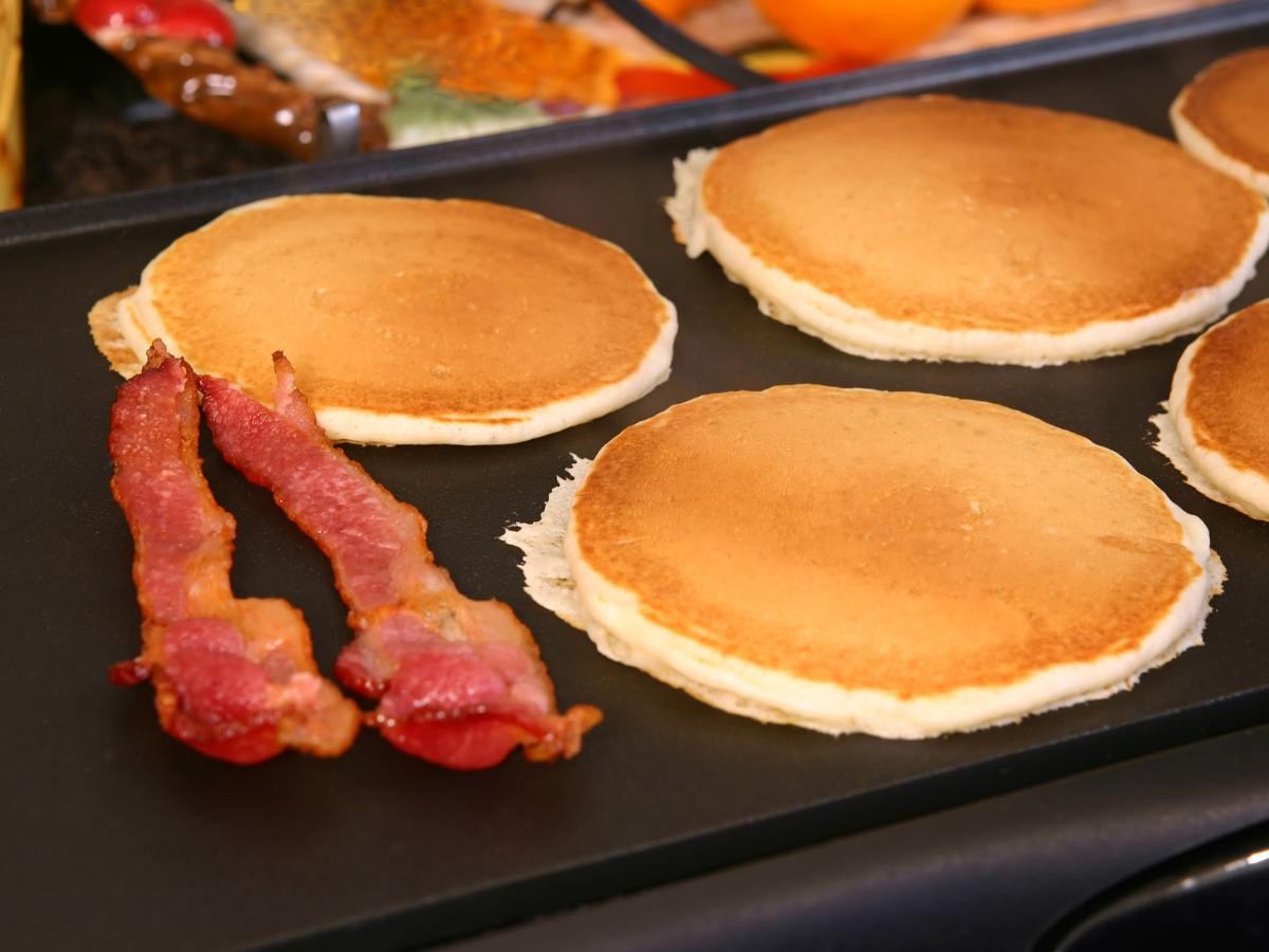 bacon and pancakes on griddle