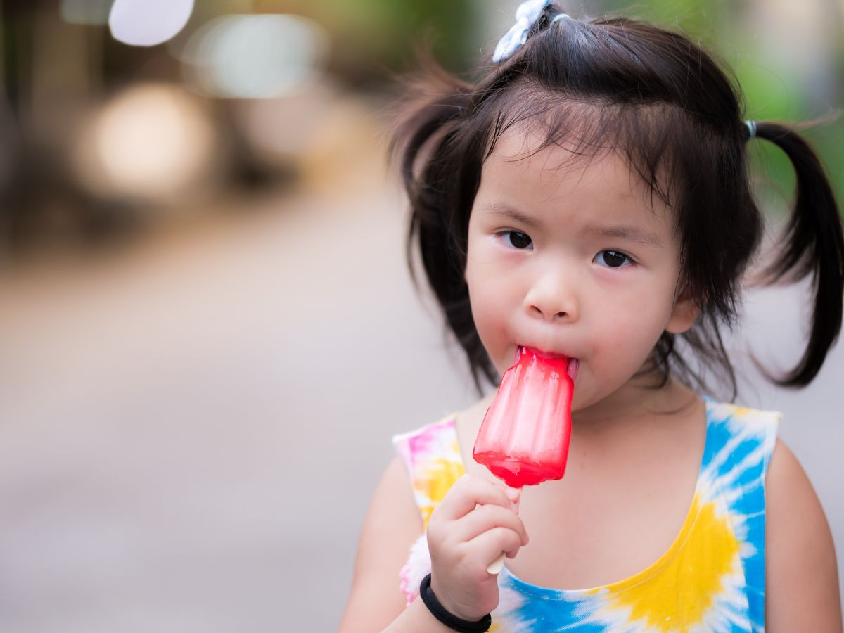 Young girl Eating a Popsicle