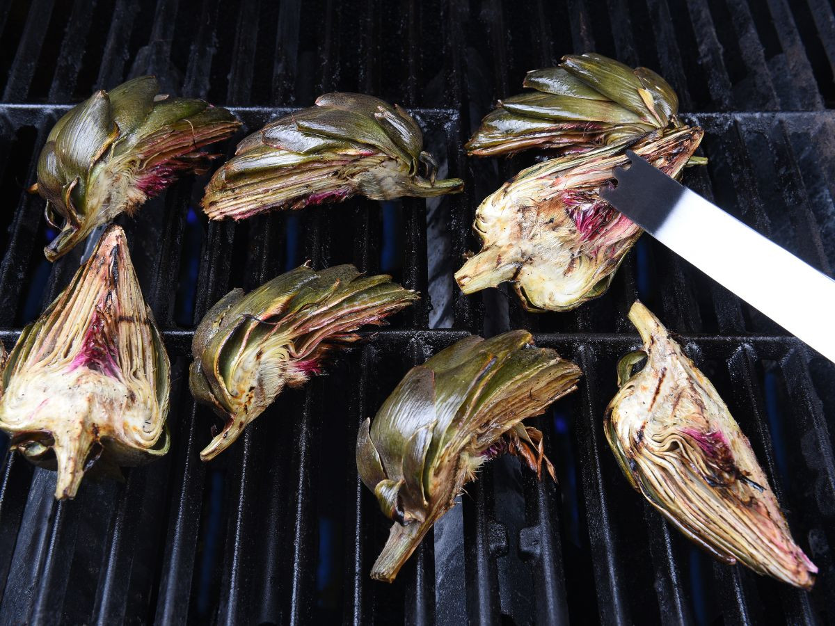 flipping artichokes on grill