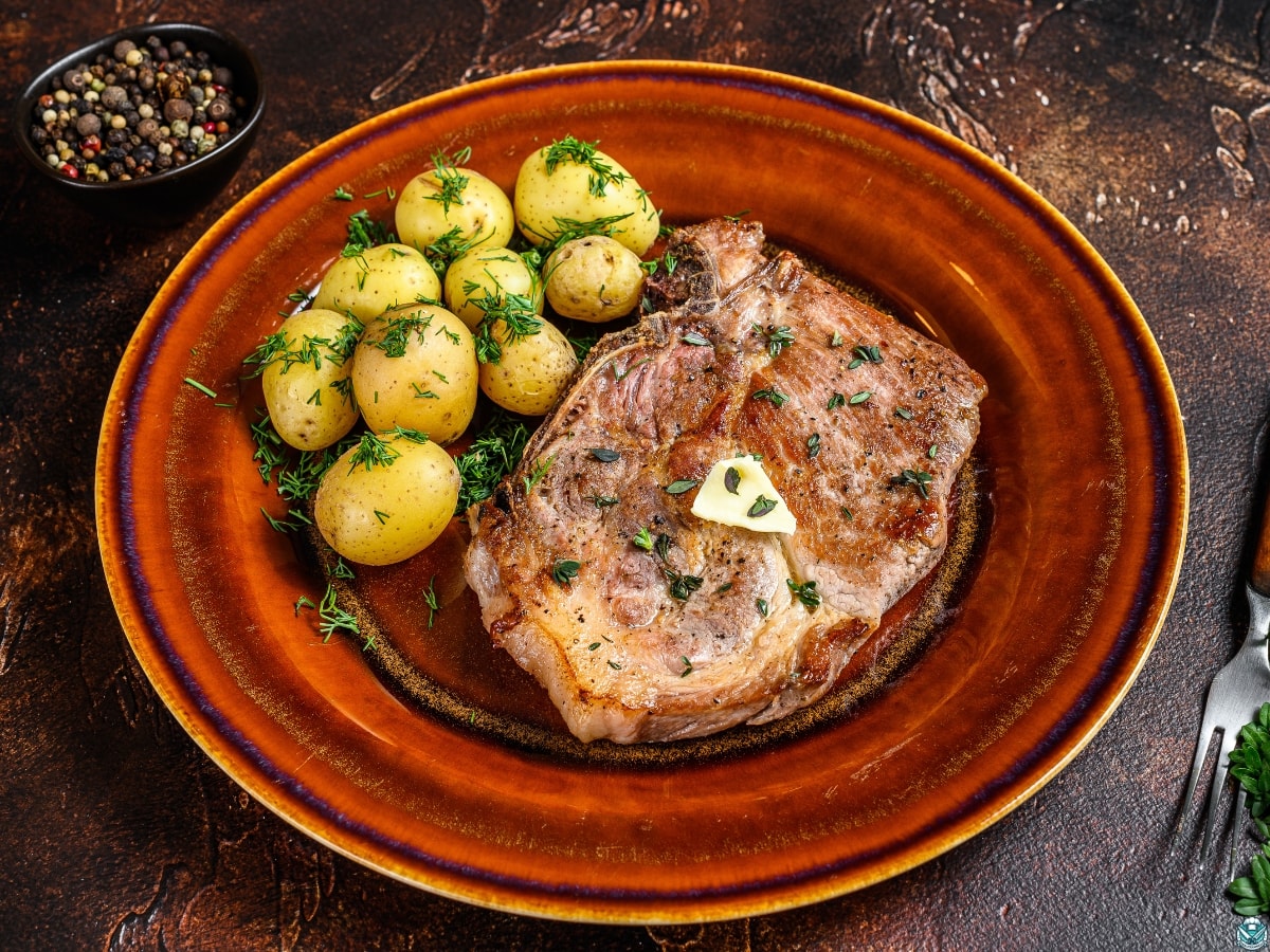 pork chops and potatoes on a plate